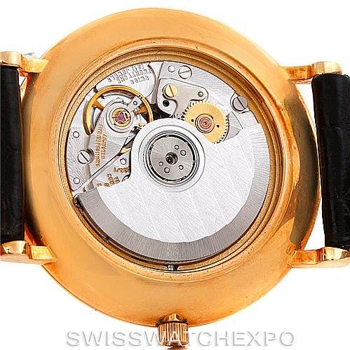 The image shows the back view of a Vintage Vacheron Constantin watch, displaying its intricate mechanical movement.