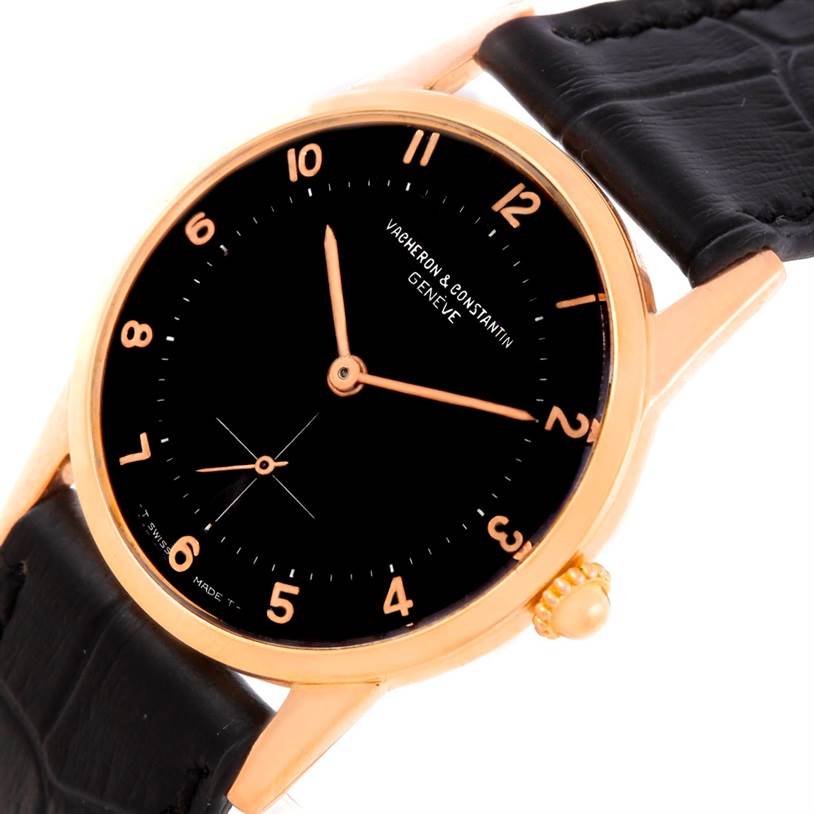 The image displays a Vacheron Constantin Vintage Men's Rose Gold Black Dial Men's Rose Gold Black Dial watch from a slightly tilted angle, showing the black dial, gold case, minute markers, and leather strap.