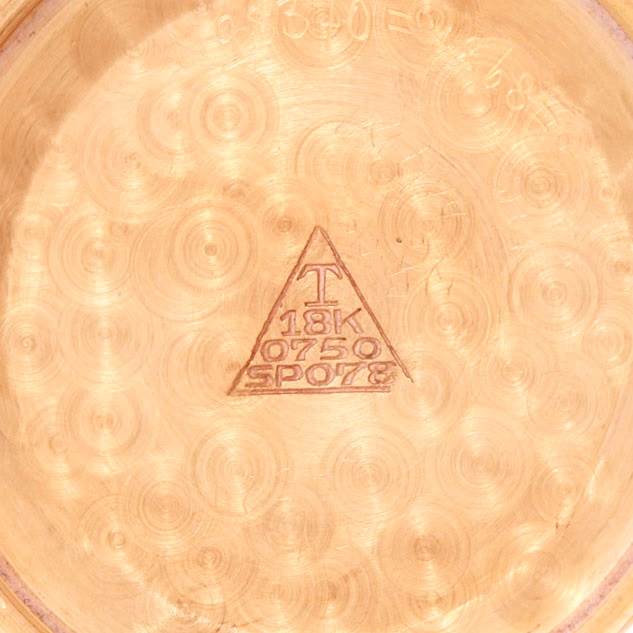 The image shows the interior caseback of a Vintage Vacheron Constantin watch, highlighting its 18K gold marking.