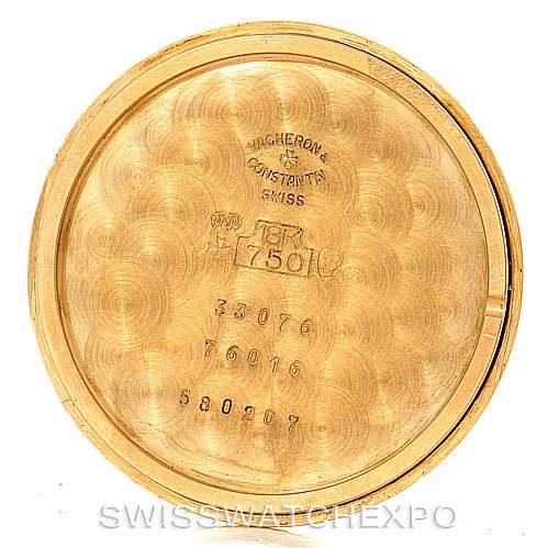 The image shows the inner case back of a Vintage Vacheron Constantin watch, displaying various engravings and markings.