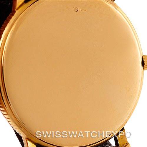 This image shows the back case of a Vintage model by Vacheron Constantin from an angle showcasing the gold-tone finish and crown.