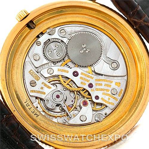 The image shows the back view of the Vacheron Constantin Vintage 33076 Men's Yellow Gold Beige Dial 33076 Men's Yellow Gold Beige Dial watch, highlighting the intricate movement and internal mechanisms.