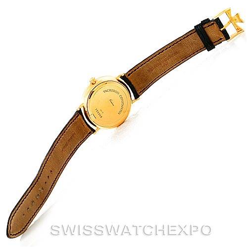 This Vintage Vacheron Constantin watch is shown from the back, highlighting the case back and leather strap.
