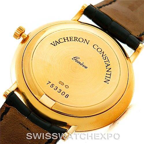 The image shows the back of a Vintage Vacheron Constantin watch, focusing on the case back inscription and leather strap.