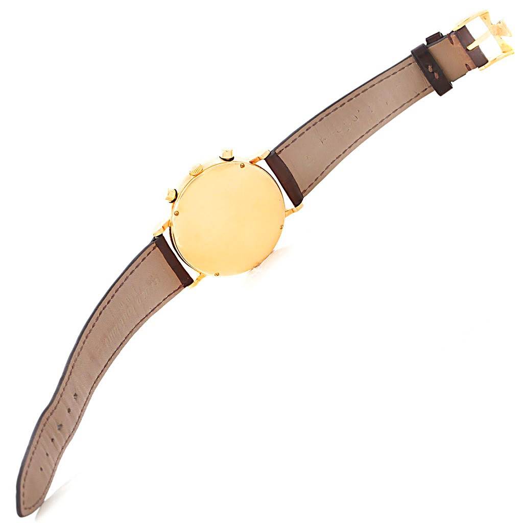 The image shows the back casing, buttons, and leather strap of a Vintage Vacheron Constantin watch at an angle.