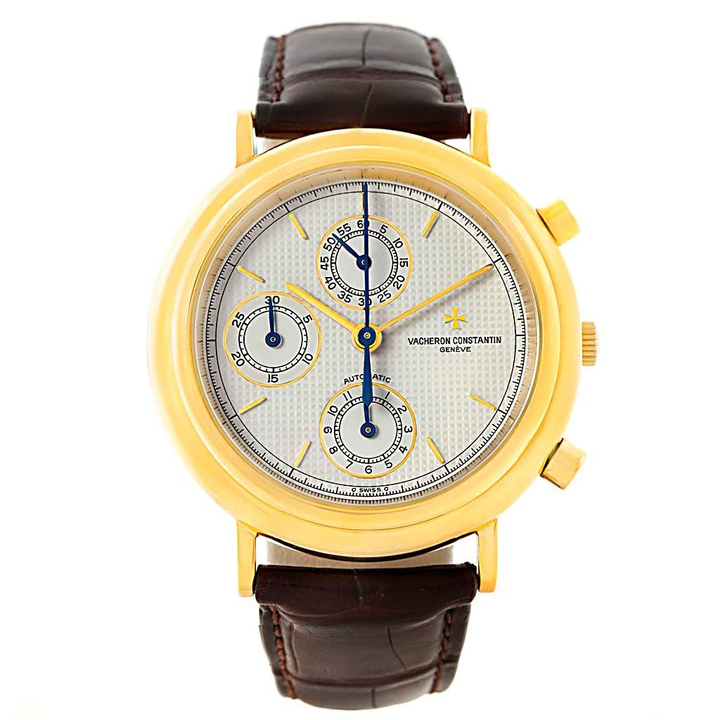 The image shows a front view of a Vintage model by Vacheron Constantin, featuring a gold case, chronograph dials, and a brown leather strap.