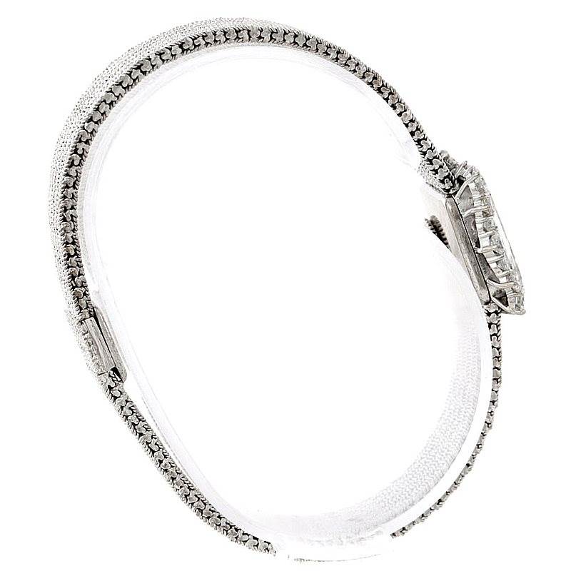 This image shows a side view of a Vintage Vacheron Constantin watch, highlighting its diamond-studded band and case.