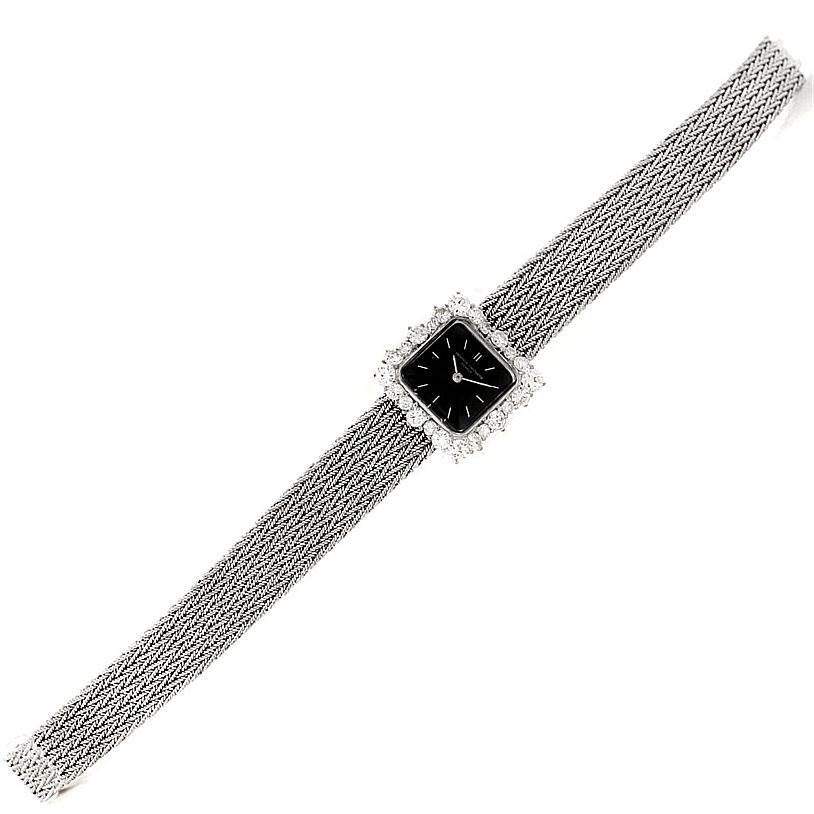 The image shows a full view of a Vintage Vacheron Constantin watch with a square black dial and a woven metal bracelet.