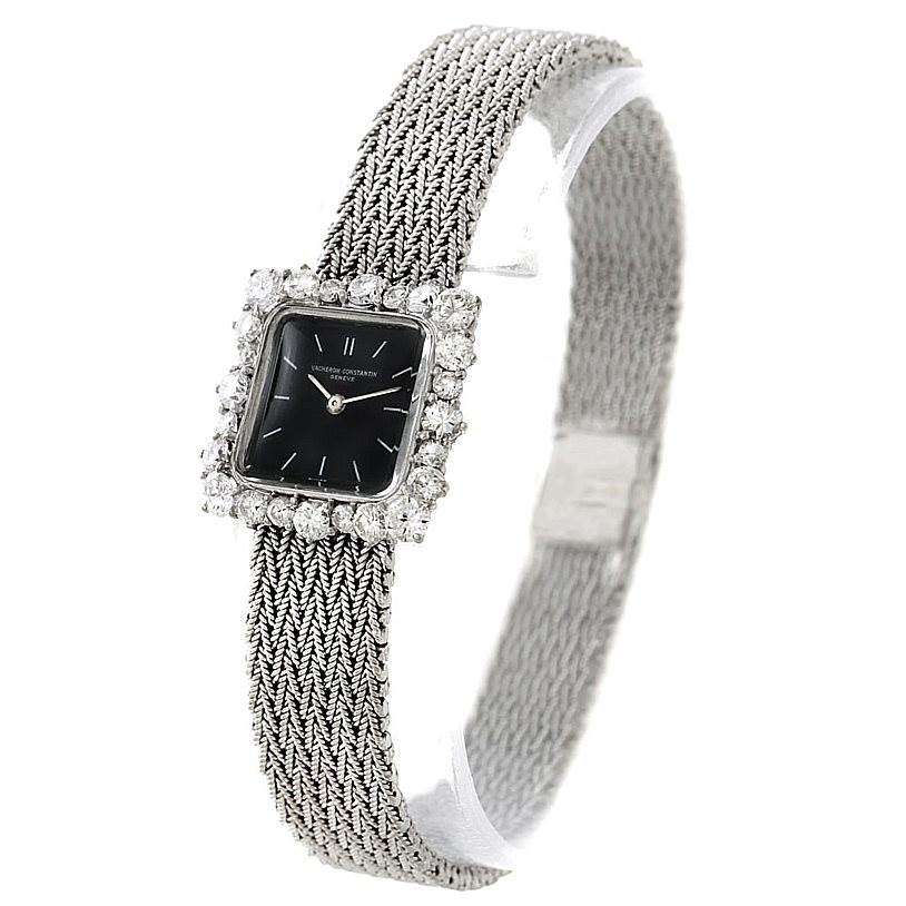 The image shows a Vintage Vacheron Constantin watch with a woven band and a diamond-embellished bezel viewed from an angled perspective.