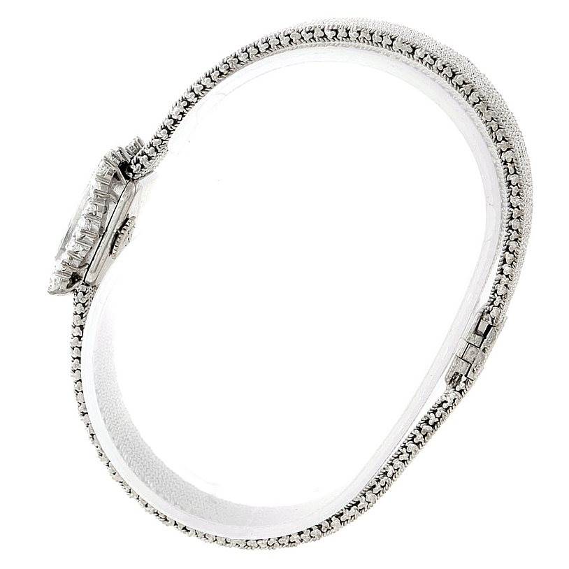 The image shows a side profile and top view of the Vintage Vacheron Constantin watch, highlighting the clasp and intricate band.