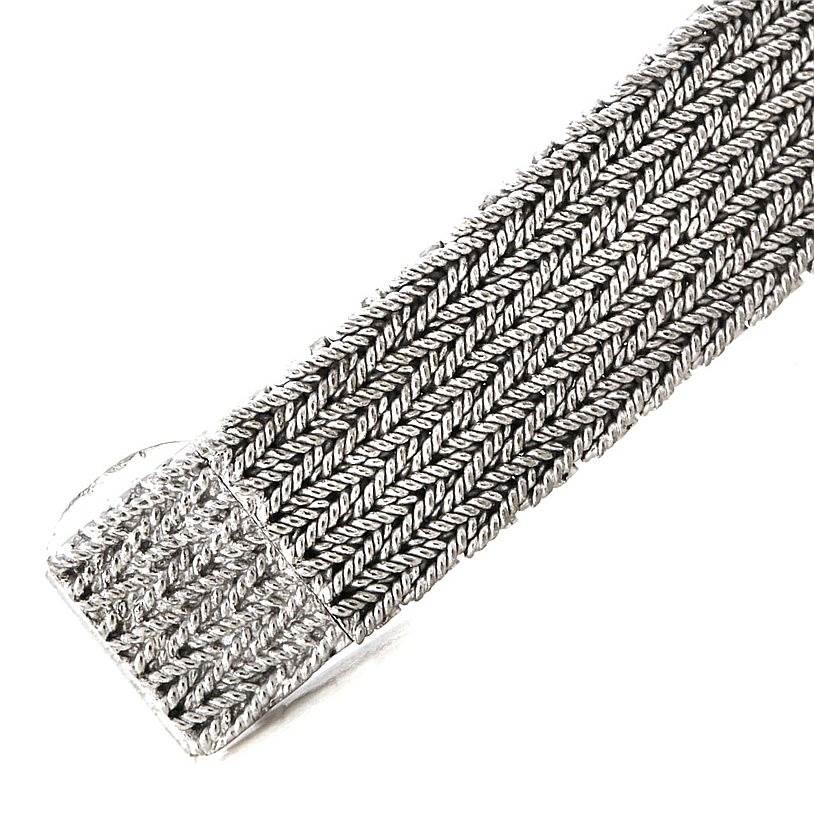 This image shows a close-up of the woven metal bracelet of a Vintage Vacheron Constantin watch.