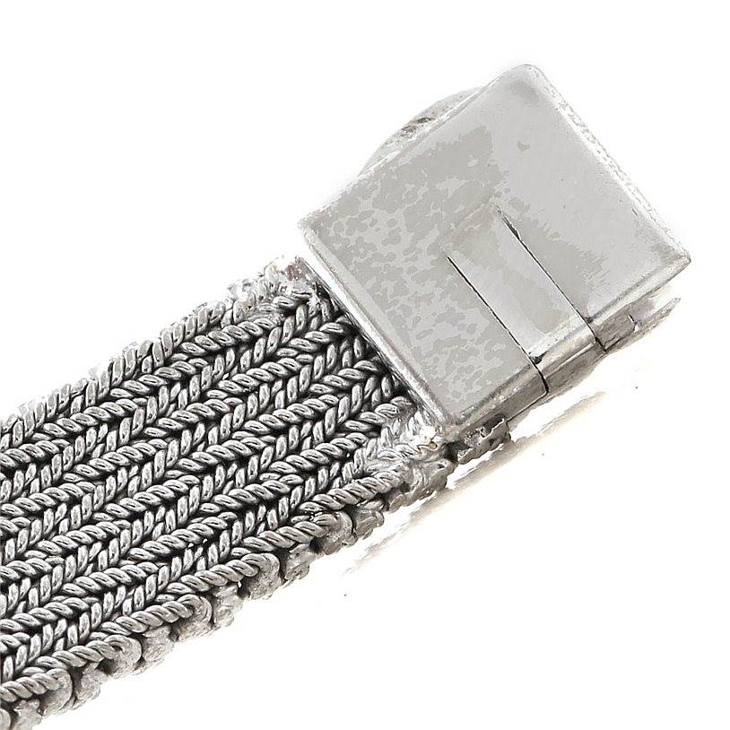 This image shows a close-up of the clasp and woven metal bracelet of a Vintage Vacheron Constantin watch.