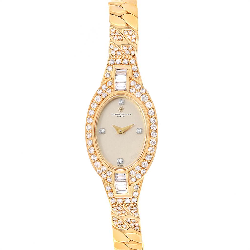 The image shows a frontal view of a Vacheron Constantin Vintage Women's Yellow Gold Silver Dial Women's Yellow Gold Silver Dial watch featuring a gold case, diamond bezel, and gold bracelet.