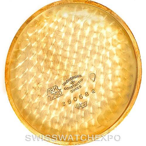 The image shows the inner case back of a vintage Vacheron Constantin watch, featuring inscriptions and maker's marks.