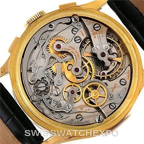 This image shows the intricate movement and inner workings of a vintage Vacheron Constantin watch, viewed from the back.