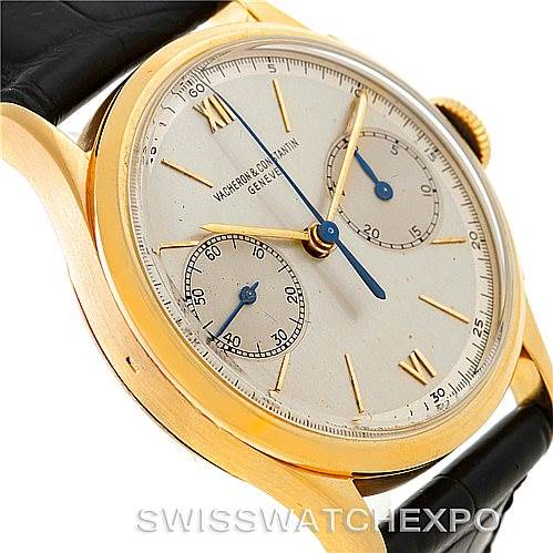 The image shows a close-up of the dial and case of the vintage Vacheron Constantin watch, highlighting its gold casing, sub-dials, and strap.