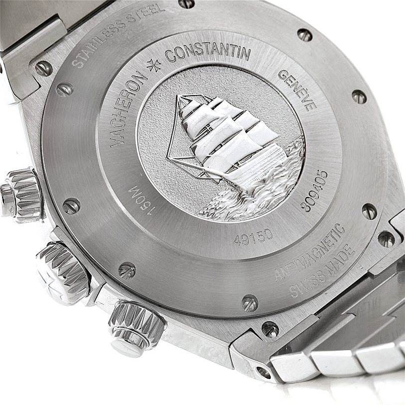 The image shows the caseback and part of the bracelet of a Vacheron Constantin Overseas 49150 Men's Stainless Steel Silver Dial 49150 Men's Stainless Steel Silver Dial watch, featuring an engraved ship.