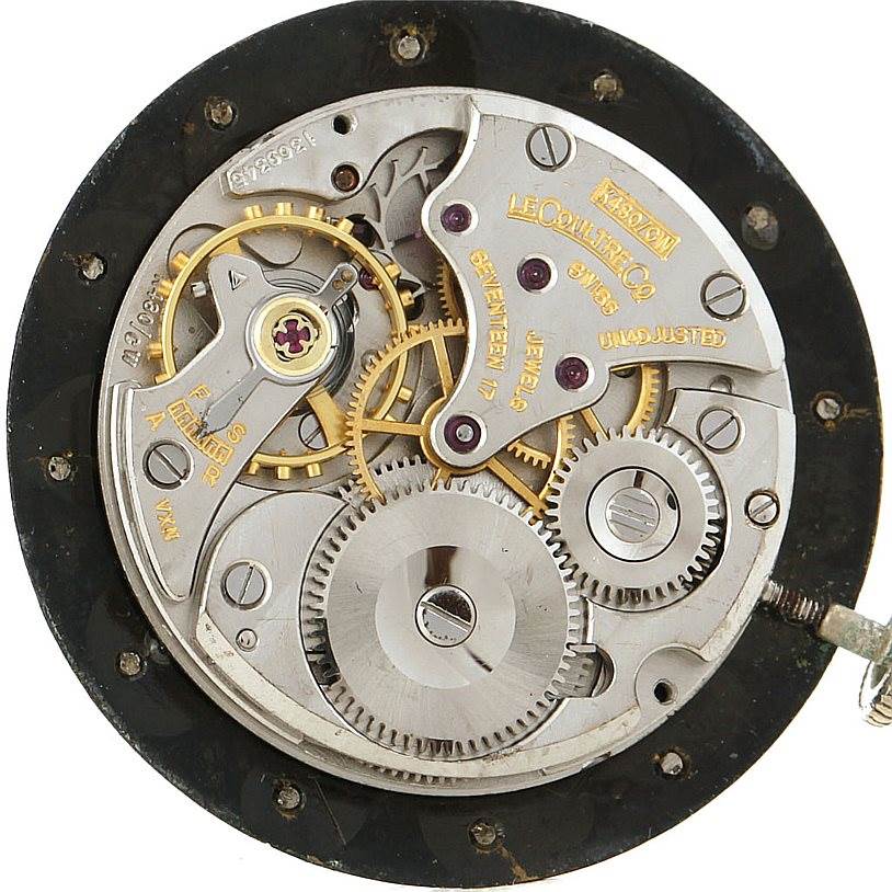 The image shows an intricate view of the inner mechanical components of a vintage Vacheron Constantin watch.