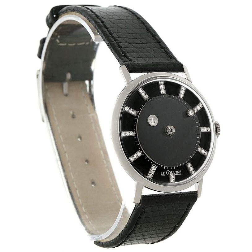 This image shows a Vacheron Constantin Vintage White Gold Black Dial White Gold Black Dial watch angled from the front-left, featuring a black dial, black leather strap, and diamond hour markers.