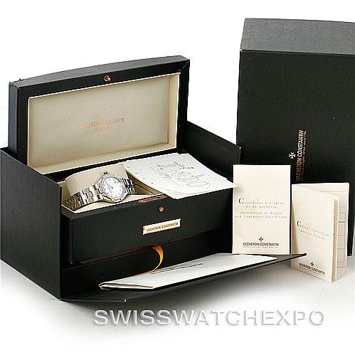 The image shows a Vacheron Constantin Overseas 25750 Women's Stainless Steel Mother of Pearl Dial 25750 Women's Stainless Steel Mother of Pearl Dial model watch and its packaging, including the box, manuals, and certification papers.