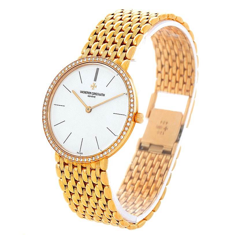 This image shows a Vintage Vacheron Constantin watch at a three-quarter angle, highlighting its gold mesh bracelet and diamond-studded bezel.