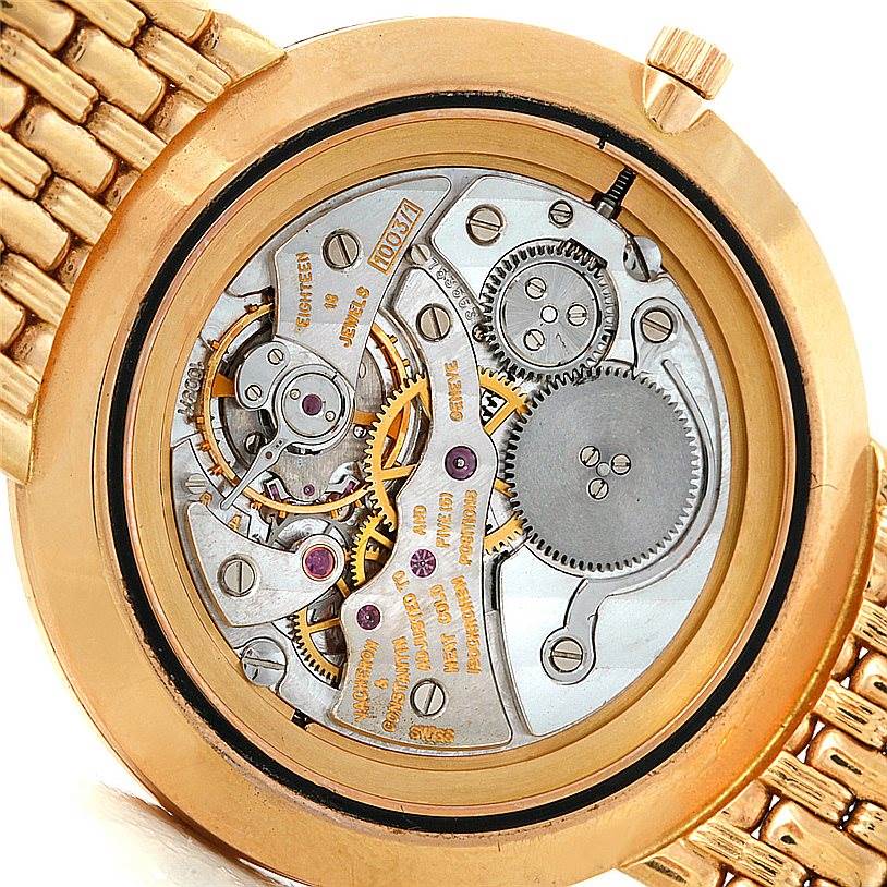 The image shows the back view of a Vintage Vacheron Constantin watch, revealing its internal movement and mechanical components.