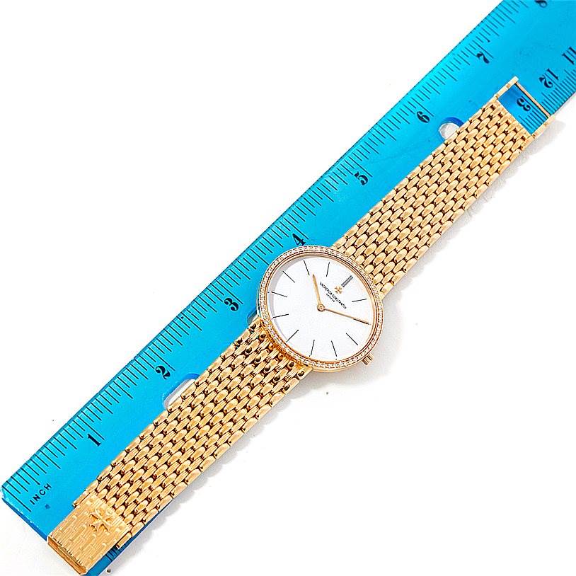 This image shows a Vacheron Constantin Vintage 33593 Men's Yellow Gold White Dial 33593 Men's Yellow Gold White Dial watch, viewed from above, highlighting the watch face and woven metal band.