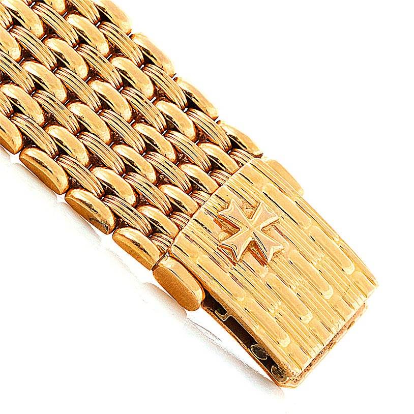 This image shows the gold bracelet and clasp of a Vintage Vacheron Constantin watch, featuring the brand's logo.