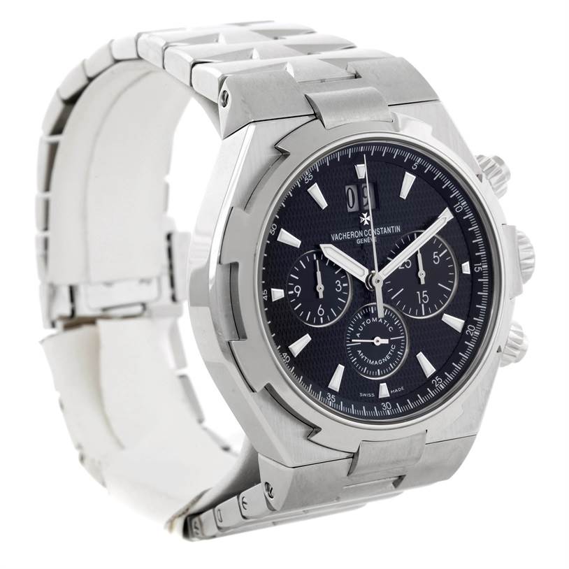The image shows a Vacheron Constantin Overseas 49150.B01A.9097 Men's Stainless Steel Black Dial 49150.B01A.9097 Men's Stainless Steel Black Dial model watch at a three-quarter angle, displaying its face, bezel, and partial bracelet.