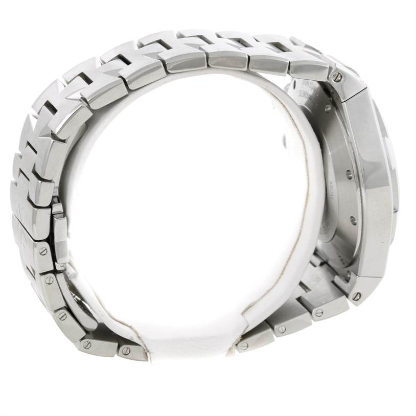 The image shows a side angle of a Vacheron Constantin Overseas 49150.B01A.9097 Men's Stainless Steel Black Dial 49150.B01A.9097 Men's Stainless Steel Black Dial watch, highlighting its stainless steel bracelet and case.