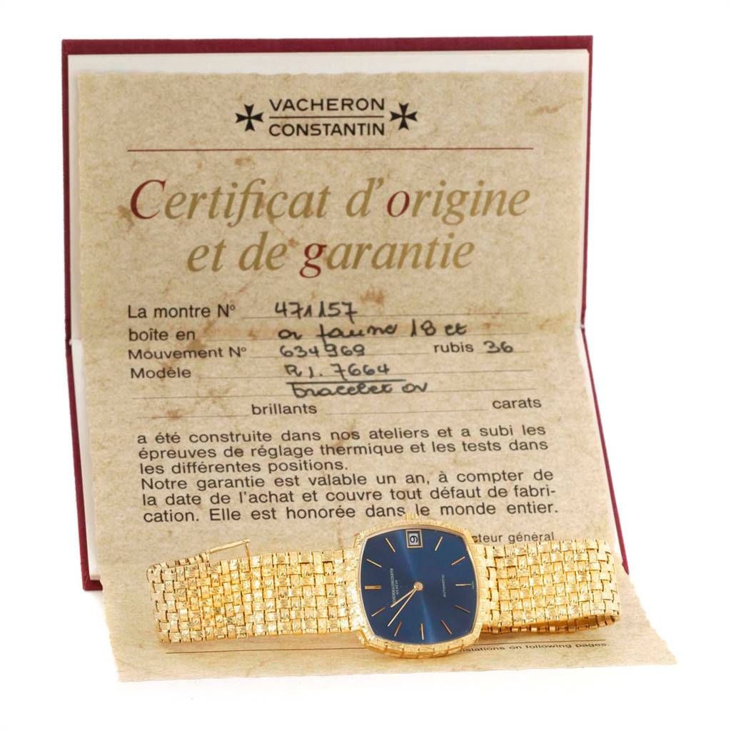 The image shows a flat view of the Vacheron Constantin Vintage 7664 Men's Yellow Gold Blue Dial 7664 Men's Yellow Gold Blue Dial model watch laid on its certificate.