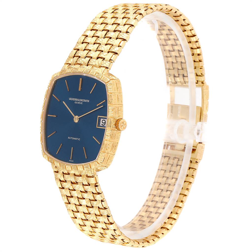 The image shows a Vintage Vacheron Constantin watch with a blue dial, gold case, and textured gold bracelet, viewed from a front angle.