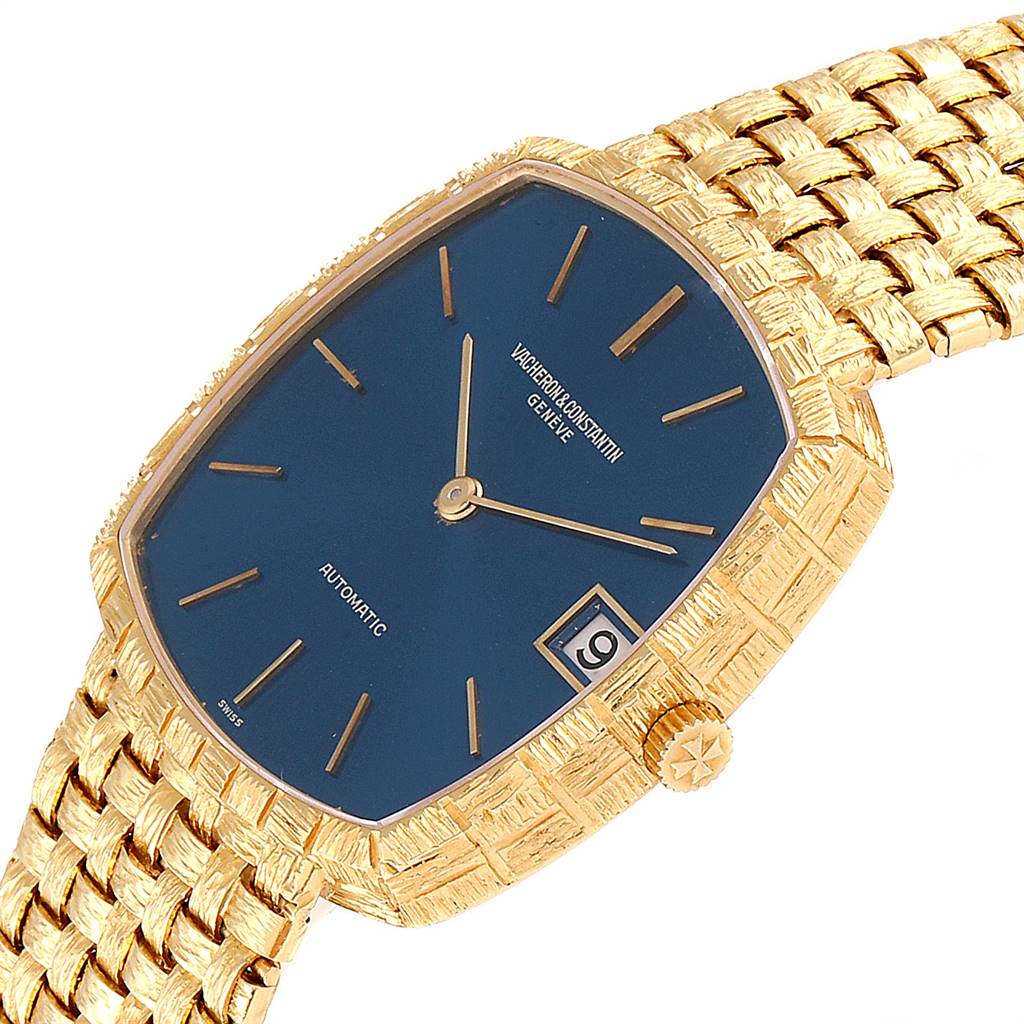This image shows a Vacheron Constantin Vintage 7664 Men's Yellow Gold Blue Dial 7664 Men's Yellow Gold Blue Dial watch at an angled side view, highlighting its gold case, blue dial, and textured gold bracelet.