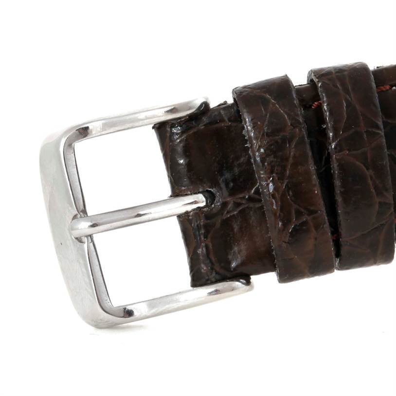 This image shows a close-up of the brown leather strap and metal buckle of a vintage Vacheron Constantin watch.