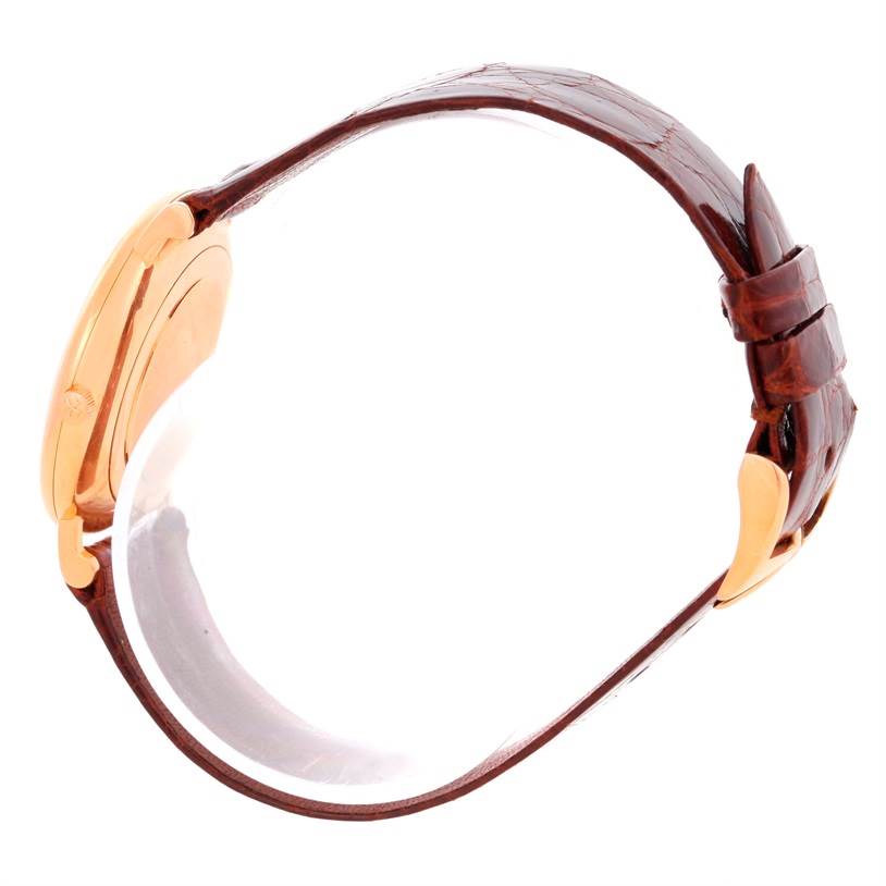 This image displays a side view of the Vacheron Constantin Patrimony 39005 Men's Rose Gold White Dial 39005 Men's Rose Gold White Dial watch emphasizing the case, crown, and brown leather strap.