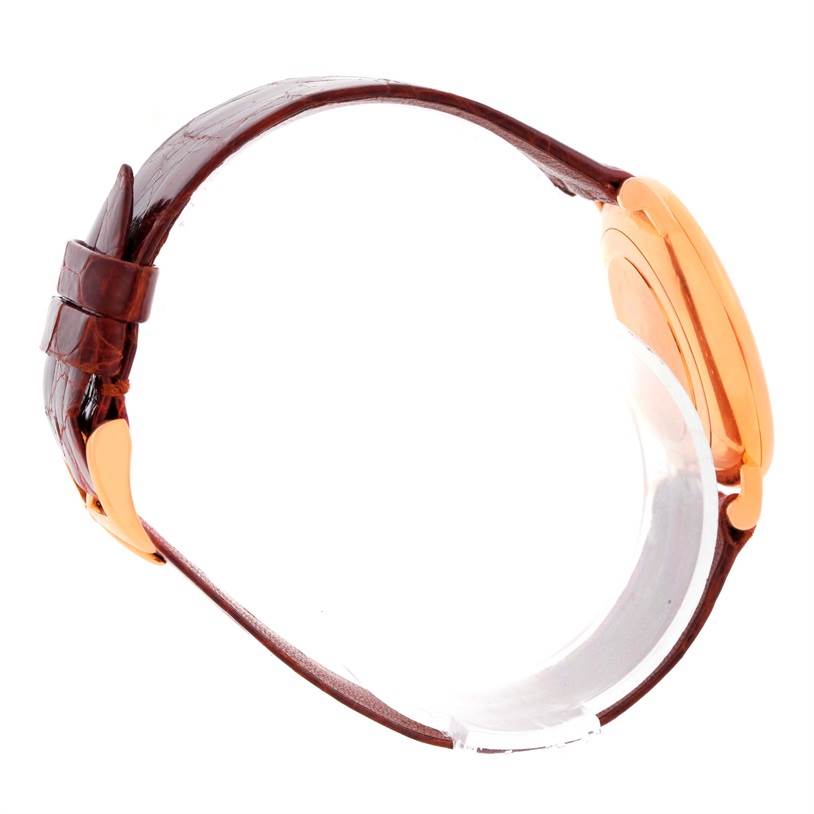 The image shows a side profile of a Vacheron Constantin Patrimony 39005 Men's Rose Gold White Dial 39005 Men's Rose Gold White Dial watch, highlighting its brown leather strap and gold-tone case.