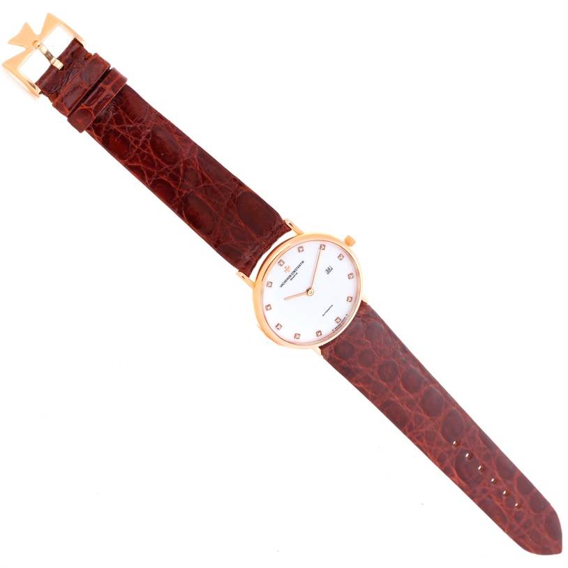 The Vacheron Constantin Patrimony 39005 Men's Rose Gold White Dial 39005 Men's Rose Gold White Dial watch is shown from a top-down angle, displaying the face, strap, and buckle.