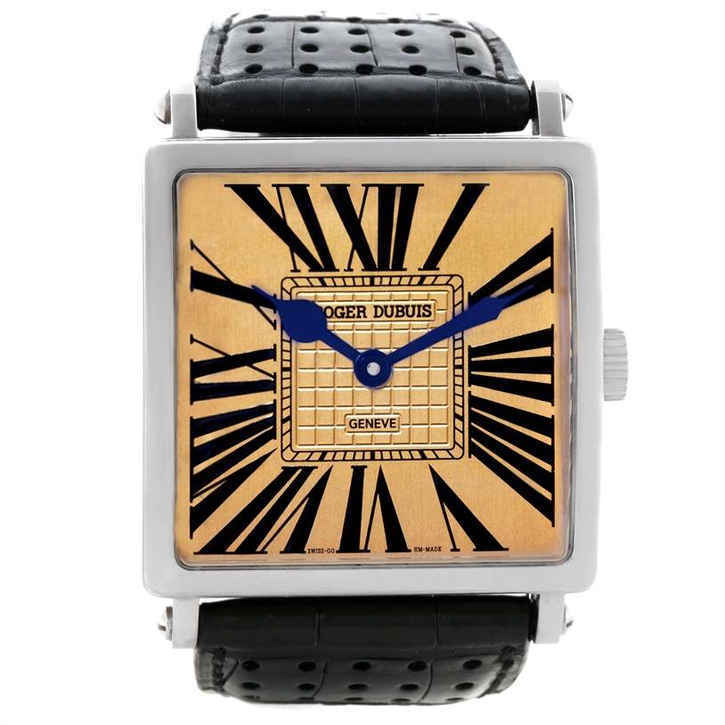 The image shows the front view of a Roger Dubuis Men's White Gold Champagne Dial Men's White Gold Champagne Dial Golden Square White Gold Limited Edition Mens Watch with a black leather strap.