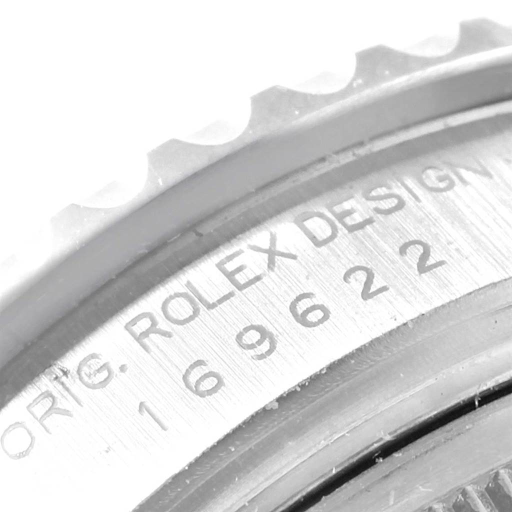 This image shows a close-up of the bezel and engraved case back of a Rolex Yacht-Master 169622 Women's Stainless Steel Silver Dial 169622 Women's Stainless Steel Silver Dial watch.