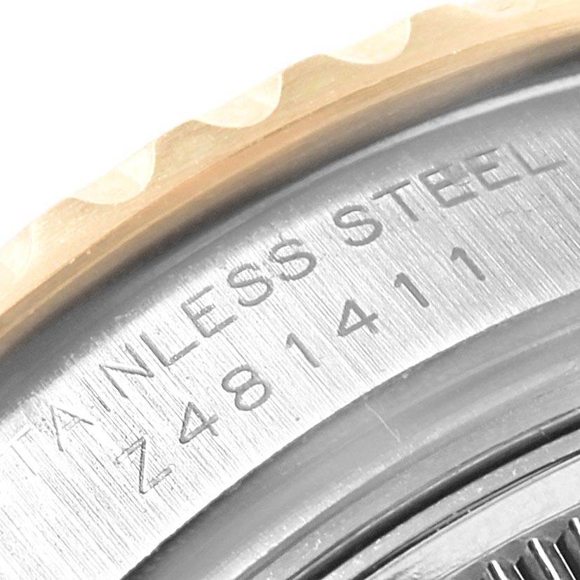 The image shows a close-up of the stainless steel case back part of the Rolex Yacht-Master 169623 Women
s Steel and Gold (two tone) White Dial 169623 Women
s Steel and Gold (two tone) White Dial watch with visible engravings.