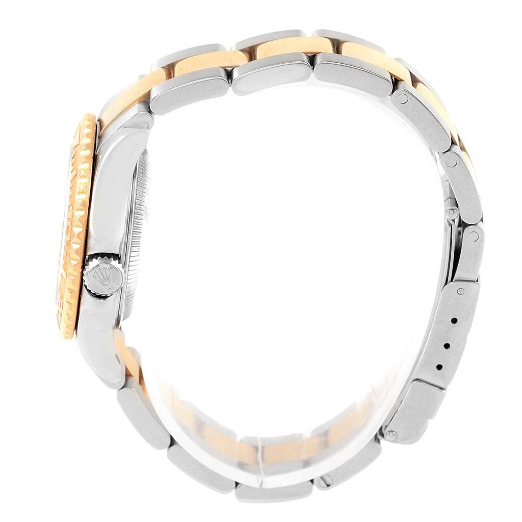 This image shows a side view of a Rolex Yacht-Master 169623 Women
s Steel and Gold (two tone) White Dial 169623 Women
s Steel and Gold (two tone) White Dial watch, highlighting the crown, bezel, and the two-tone bracelet.