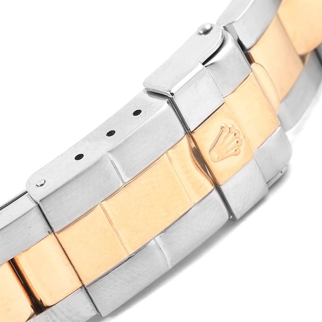 This image shows a close-up of the bracelet of a Rolex Yacht-Master 169623 Women
s Steel and Gold (two tone) White Dial 169623 Women
s Steel and Gold (two tone) White Dial watch, displaying its two-tone metal links and clasp.