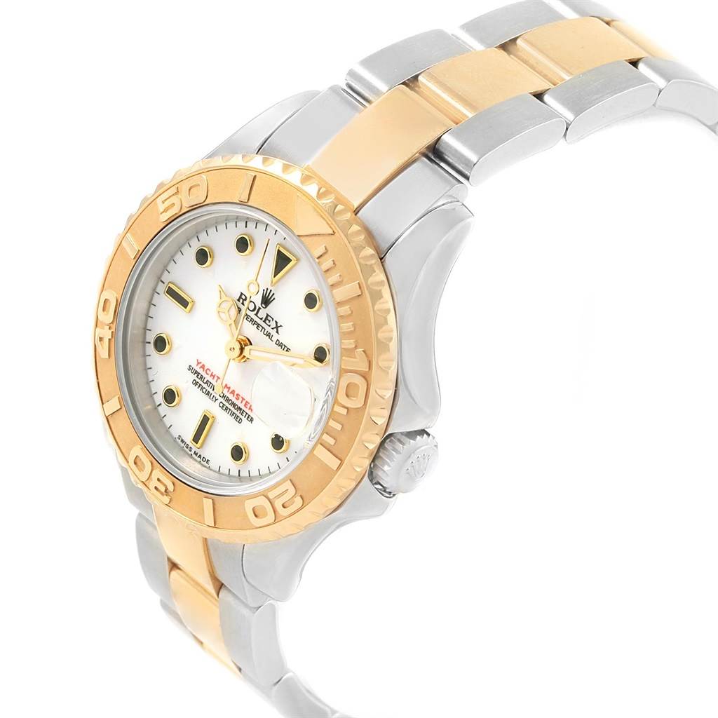 The image shows a side and front angle of a Rolex Yacht-Master 169623 Women
s Steel and Gold (two tone) White Dial 169623 Women
s Steel and Gold (two tone) White Dial watch, highlighting the dial, bezel, and part of the bracelet.