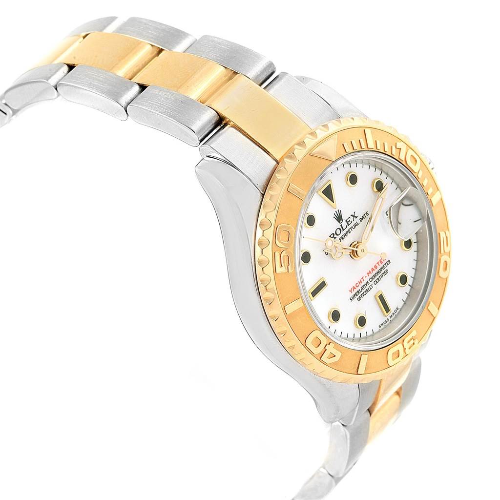 The image showcases a side view of the Rolex Yacht-Master 169623 Women
s Steel and Gold (two tone) White Dial 169623 Women
s Steel and Gold (two tone) White Dial watch, highlighting its gold and silver bracelet and bezel.