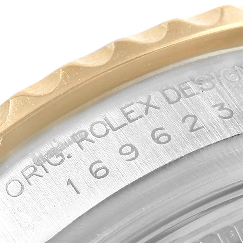 The image shows a close-up angle of the bezel and part of the case of the Rolex Yacht-Master 169623 Women
s Steel and Gold (two tone) White Dial 169623 Women
s Steel and Gold (two tone) White Dial watch.