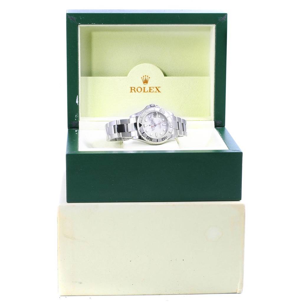 The Rolex Yacht-Master 168622 Stainless Steel Silver Dial 168622 Stainless Steel Silver Dial watch is shown from the front, nestled in its open green and beige branded box.