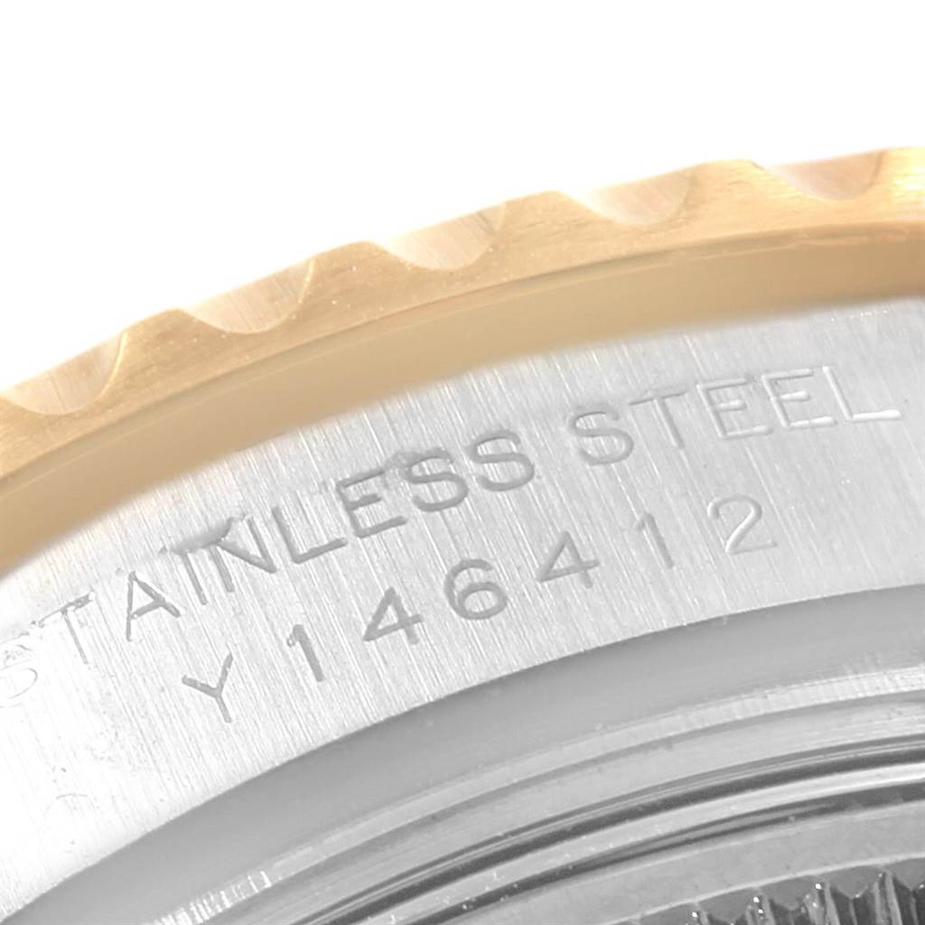 This close-up image shows the stainless steel case back and part of the gold bezel of the Rolex Yacht-Master 169623 Women's Steel and Gold (two tone) Mother of Pearl Dial 169623 Women's Steel and Gold (two tone) Mother of Pearl Dial watch.