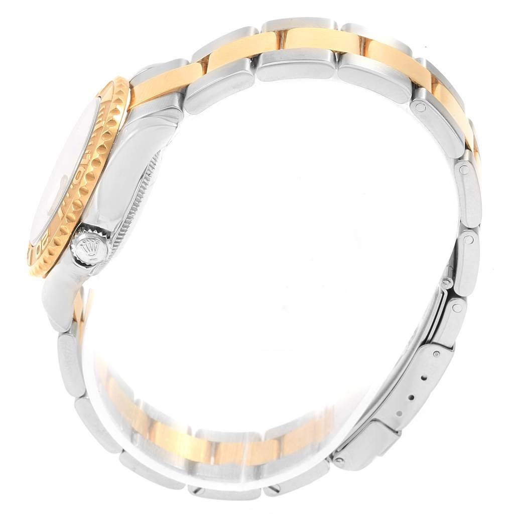 The image shows a side view of a Rolex Yacht-Master 169623 Women's Steel and Gold (two tone) Mother of Pearl Dial 169623 Women's Steel and Gold (two tone) Mother of Pearl Dial watch, featuring its two-tone bracelet and bezel.