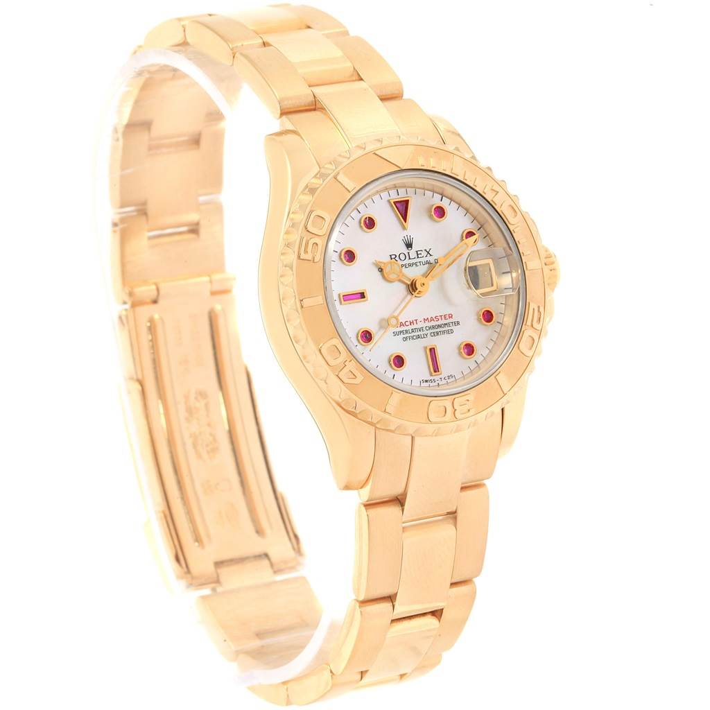 The image shows a Rolex Yacht-Master 69628 Women's Yellow Gold Mother of Pearl Dial 69628 Women's Yellow Gold Mother of Pearl Dial watch from an angled view, highlighting its gold bracelet, bezel, and dial.