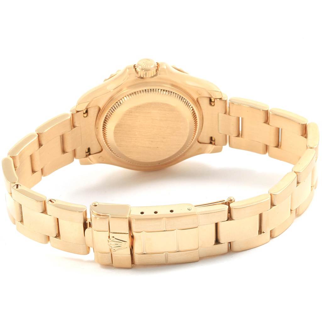 The image shows the back view of a Rolex Yacht-Master 69628 Women's Yellow Gold Mother of Pearl Dial 69628 Women's Yellow Gold Mother of Pearl Dial watch, focusing on the case back and bracelet.